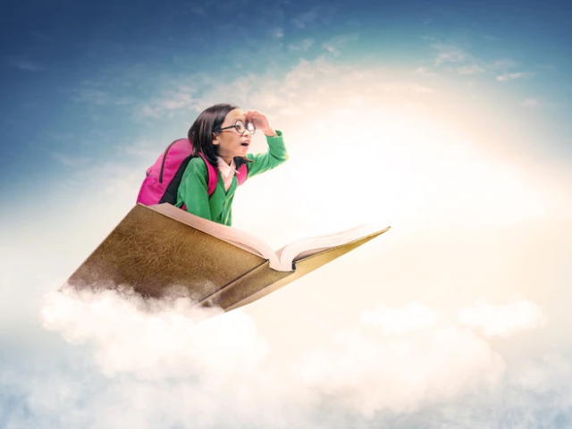jeune fille posée sur un livre ouvert dans le ciel, comme un tapis volant
