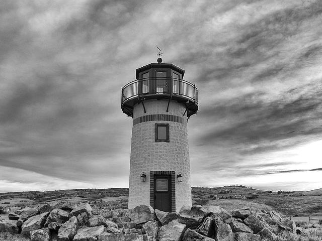 a black and white photography of a lighthouse